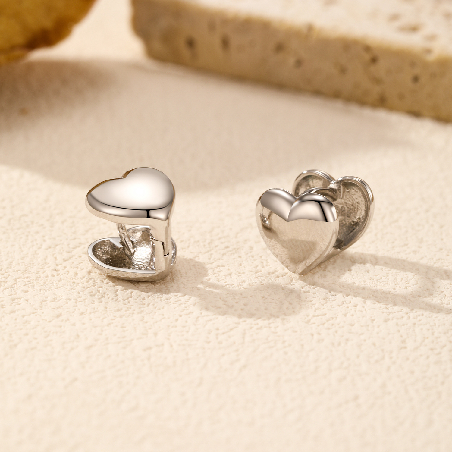 The S925 Silver Double-Sided Heart Earrings with Mirror Finish - Image 4
